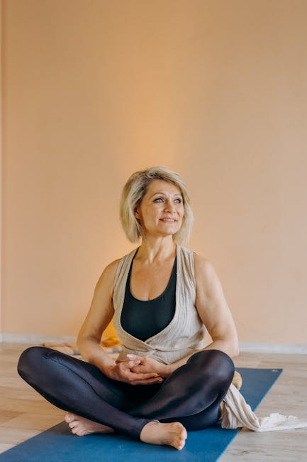 Smiling person enjoying a moment of peace on a yoga mat